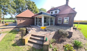 Aanleg achtertuin / bestrating Borkel en Schaft