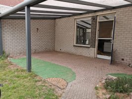 Aanleg natuursteen tegels / gazon Helmond